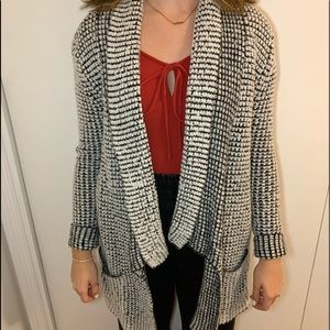 Black and white knitted sweater.